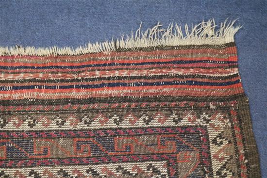 A Shiraz rug, a Bokhara saddlecloth and another rug (wear)